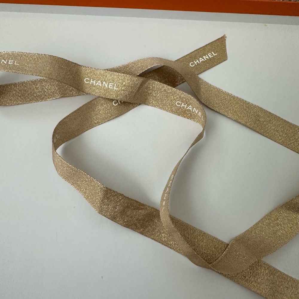 CHANEL Gold Ribbon Accessory